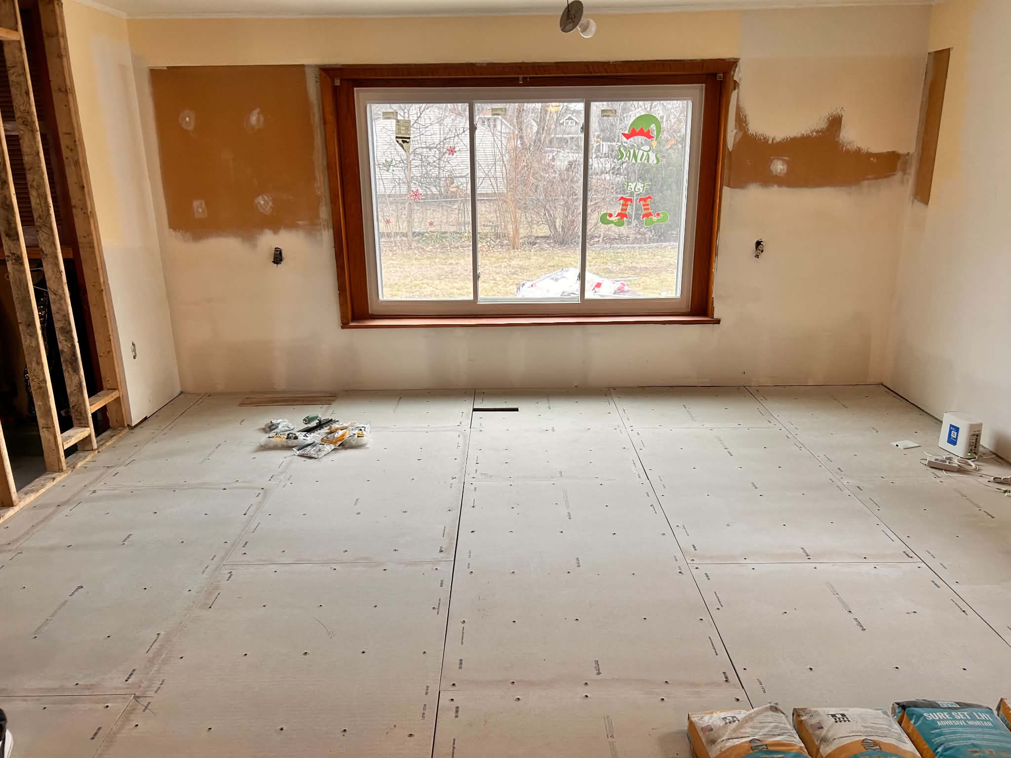 Living room with new subfloor during remodeling